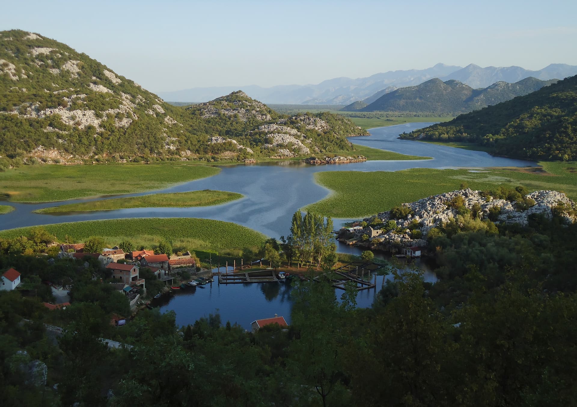 Karuč fishing village in a sheltered Skadar Lake bay, seen from the surrounding hills