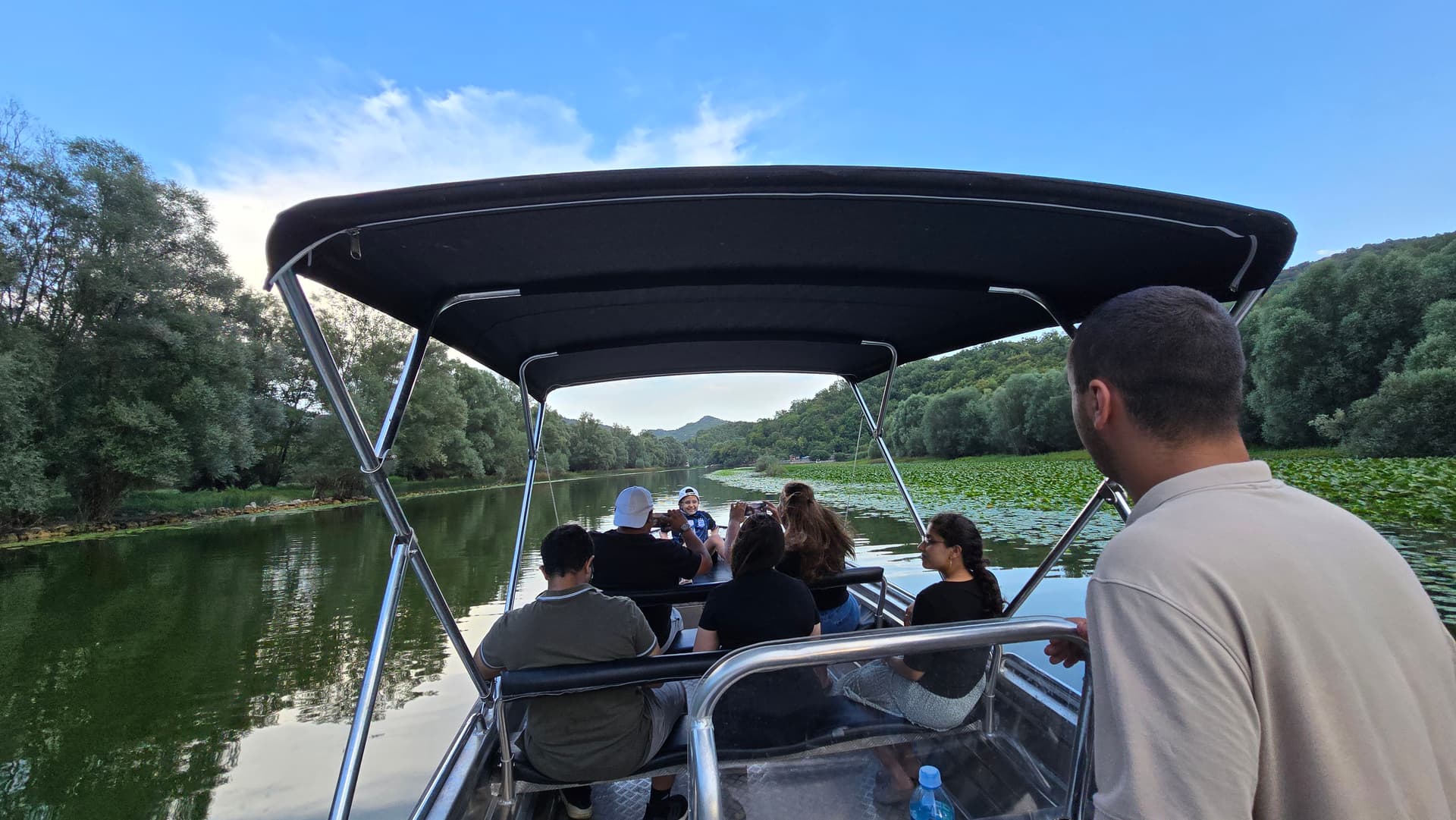 Guests cruising Skadar Lake lily channels
